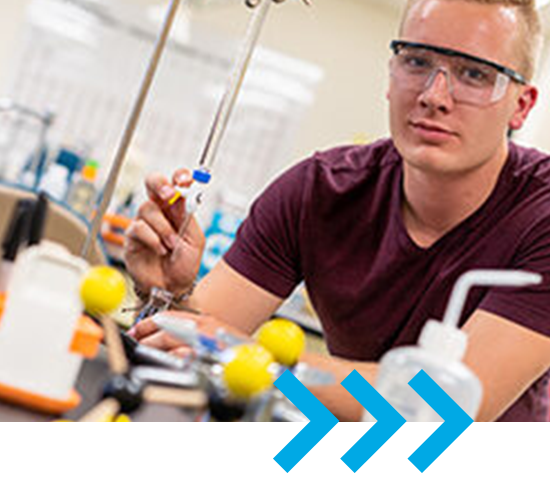 Matias Malkamaki in a lab doing an experiment.