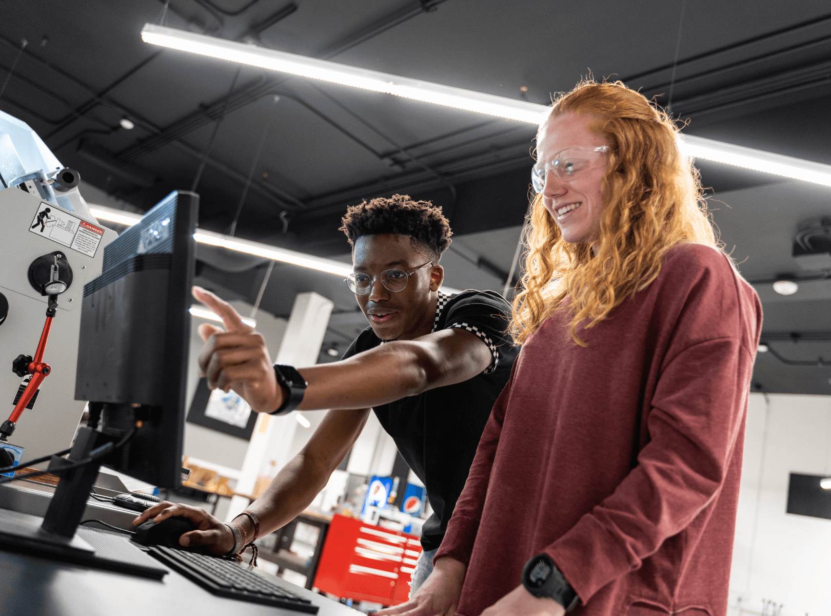 Two students working together at a computer