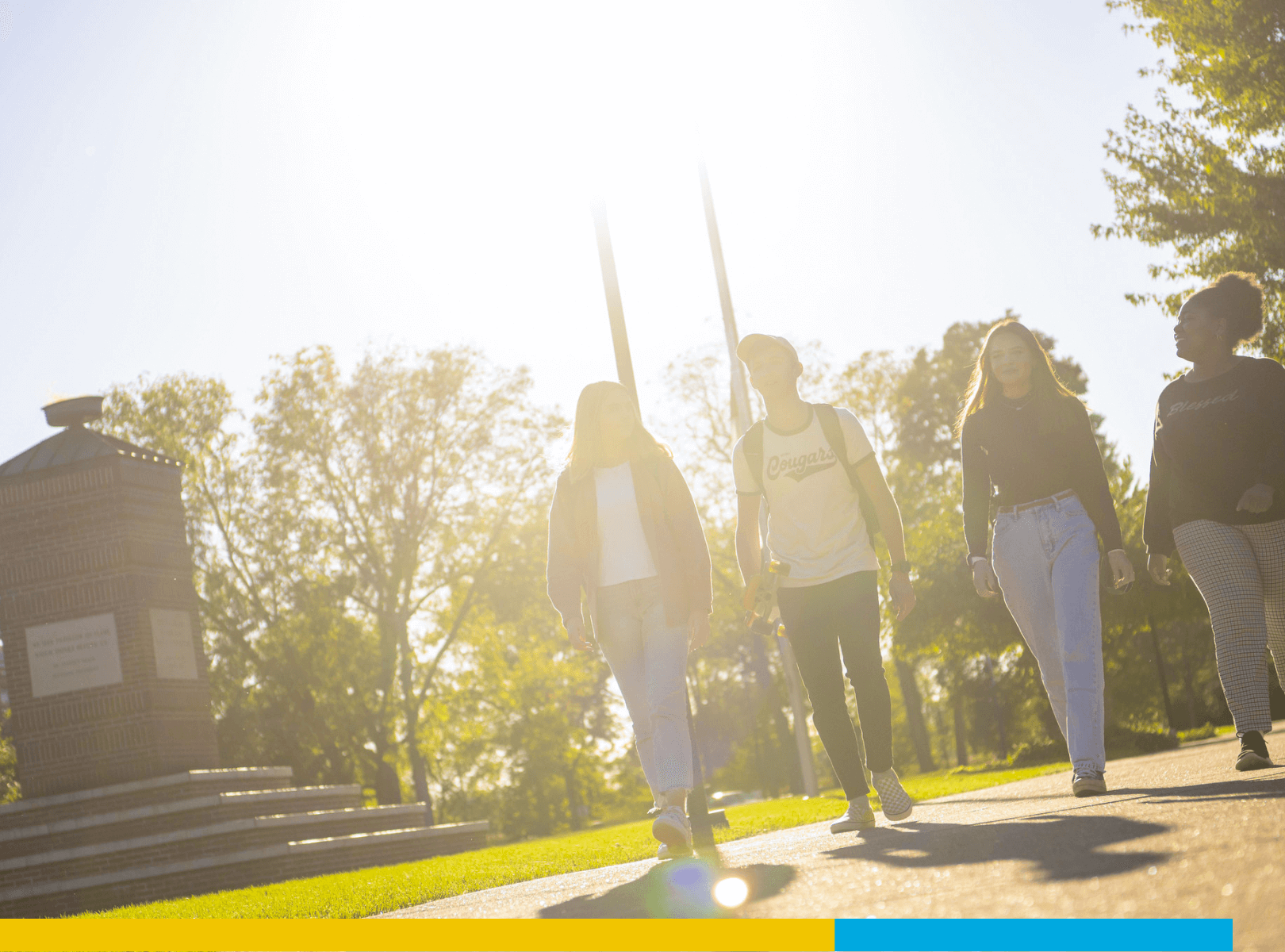 A diverse group of students walking together on campus