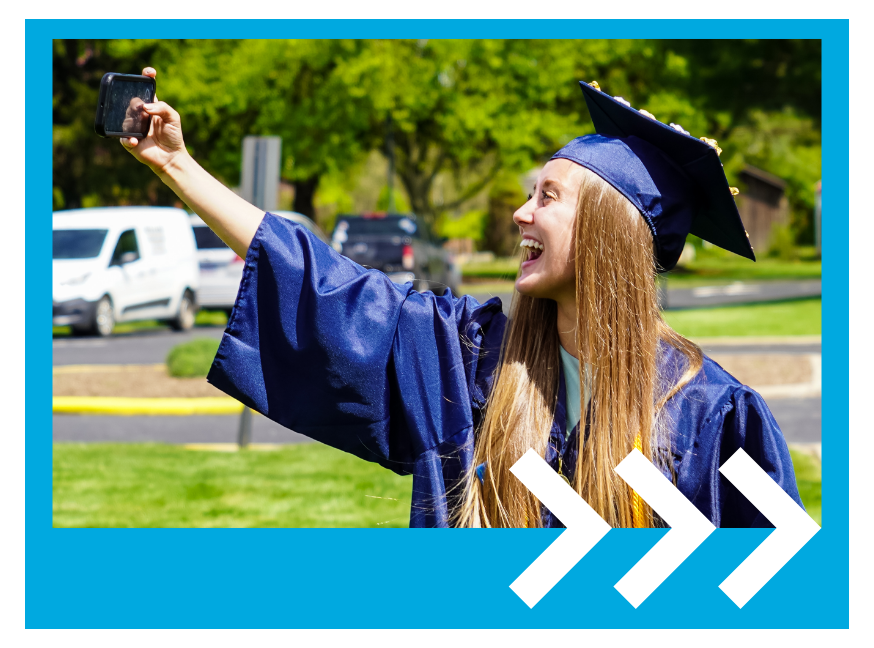 A smiling student taking a selfie at graduation
